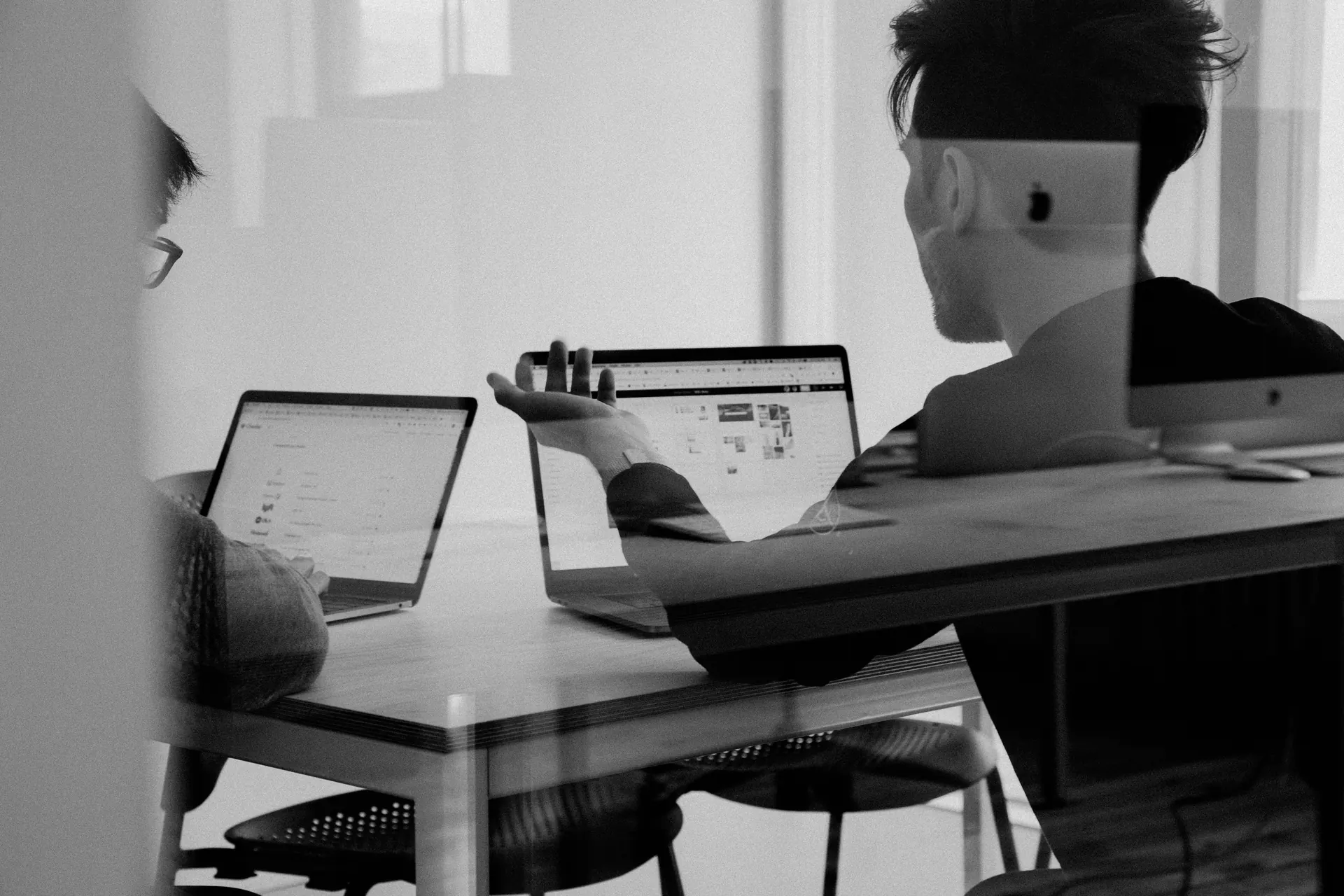 Team discussion around digital workstations